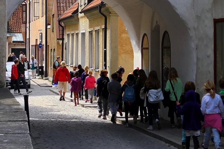 children on street in sunshine in Visby
