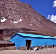 workers by shed in Andes mountains