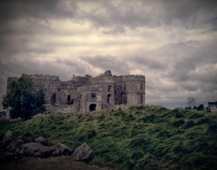 carew castle under dramatic sky and clouds Wales